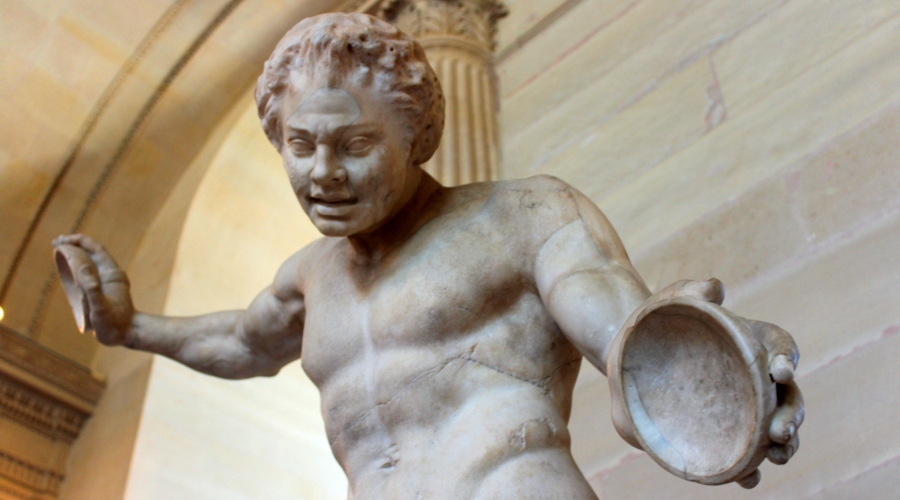 A joyful Roman statue in the Salle des Cariatides